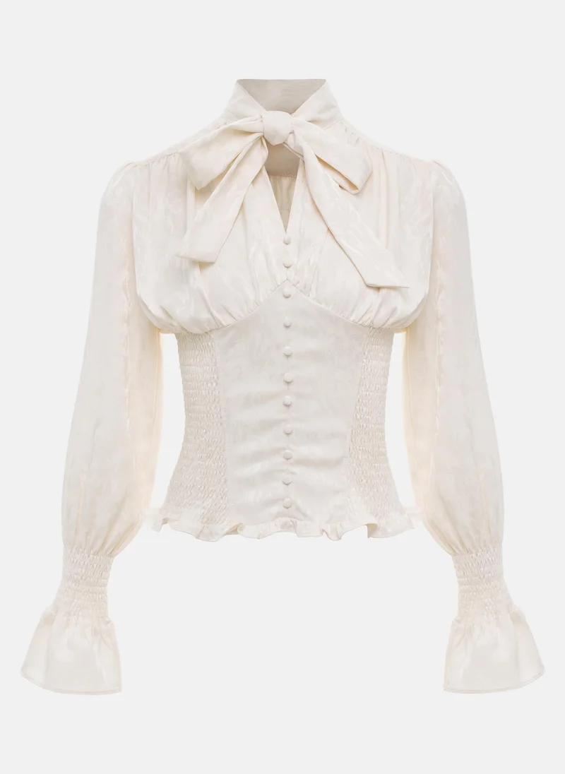 Lichi Fitted blouse with a puffy bow on the collar